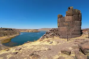 Burial Place Prints: Ancient burial ground Sillustani featuring cylindrical funerary towers and Laguna Umayo