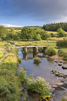 Ancient clapper bridge at Postbridge, Dartmoor National Park, Devon, England. Summer