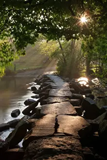 Ancient clapper bridge Tarr Steps spanning the River Barle in Exmoor, Somerset, England