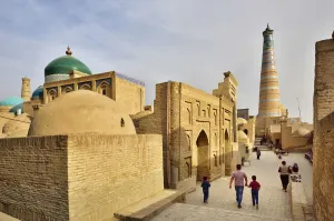 Images Dated 21st November 2018: An ancient street and the Islam Khodja minaret and medressa