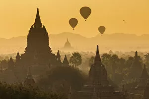 Peter Adams Collection: Ancient temple city of Bagan (Pagan) & balloons at sunrise, Myanmar (Burma)