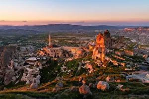 Kapadokya Prints: Ancient town of Uchisar during sunset. Cappadocia, Kaisery district, Anatolia, Turkey