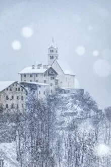 Images Dated 22nd March 2019: the ancient village of Colle Santa Lucia with the church on the hill under a snowfall