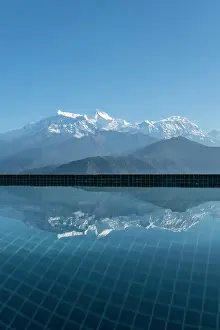 Gandaki Province Prints: Annapurna mountain range reflected in hotel pool at Sarangkot near Pokhara