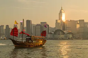 High Rise Prints: Aqua Luna junk boat and Hong Kong Island skyline at sunset, Hong Kong, China