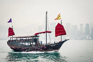 Aqua Luna traditional Junk ship sailing in Victoria Harbor, Tsim Sha Tsui, Kowloon