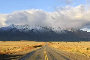 Argentina, Patagonia, Chubut Province, Route 40 with snow capped peaks