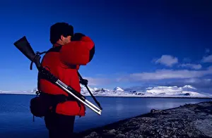 Preparation Prints: Armed guide checking for polar bears prior to land excursion