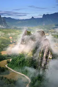 Laotian Prints: Asia, Laos, Vientiane Province, Vang Vieng, karst landscape at dawn, elevated view