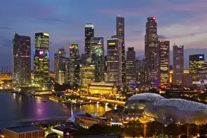Asia, Singapore, Singapore Skyline Financial district illuminated at dusk