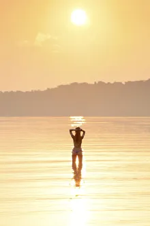 Asia, South East Asia, Cambodia, Koh Rong Samloem island, woman in a bikini silhouetted