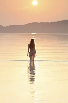 Asia, South East Asia, Cambodia, Koh Rong Samloem island, woman in a bikini silhouetted Asia, South East Asia, Cambodia, Koh Rong Samloem island, woman in a bikini silhouetted