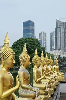 Asia, Sri Lanka, Colombo, Seema Malaka Buddhist temple on Beira Lake with Colombo City Skyline