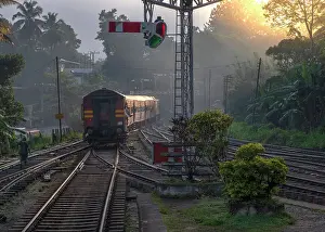 Tracks Prints: Asia, Sri Lanka, Kandy, railway train departing station at dawn; tea train