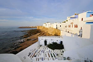 Asilahs white houses and graveyard overlooking the Atlantic Ocean. Morocco