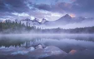 Atmospheric misty sunrise in Banff National Park in the Canadian Rockies, Alberta, Canada