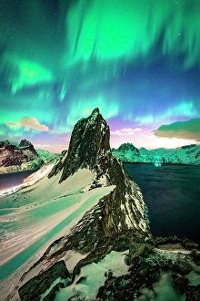 Aurora Borealis Prints: Aurora Borealis over the snowy mount Segla