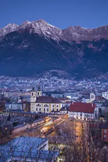 Austria, Tyrol, Innsbruck, elevated view of the Wilten Basilica, dawn, winter