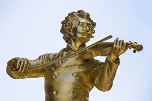 Austria, Vienna, Stadtpark - City Park, Iconic gold statue of Johann Strauss Austria, Vienna, Stadtpark - City Park, Iconic gold statue of Johann Strauss