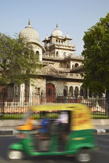 Autorickshaw passing Albert Hall, Jaipur, Rajasthan, India