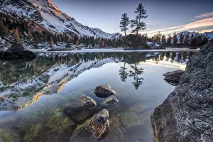 Snowy Peaks Prints: Autumn reflections at Saoseo Lake still partially frozen Poschiavo Valley Canton of