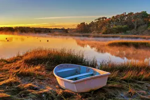 Cape Cod Prints: Autumn sunrise on a Cape Cod marsh with rowboat, Harwich, Massachusetts, USA