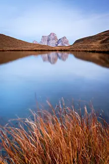 Environment Prints: Autumn sunset over Monte Pelmo peak perfectly mirrored in the pristine water of Lago delle Baste lake