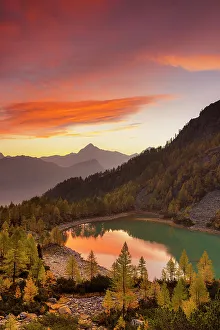 Sunrises Prints: Autumnal sunrise at Lake Lagazzuolo. Valmalenco, Valtellina, Lombardy, Italy