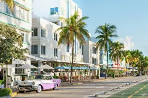 Art Deco Prints: Avalon Hotel with pink Vintage Car Ocean Drive Art Deco District South Beach