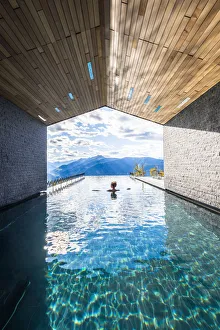 Girls Prints: Avelengo, Bolzano province, Trentino Alto Adige, Italy Girl relaxes in the pool