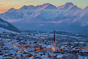 Snow Covered Prints: Axams, as seen from the Panorama Weg hiking trail with the Mieming mountain range