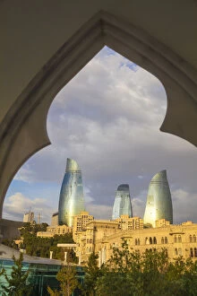 Azerbaijan, Baku, Flame Towers viewed through arches at Venezia Restaurant on The