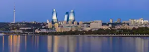 Azerbaijan, Baku, View of the Flame Towers reflecting in the Caspian Sea