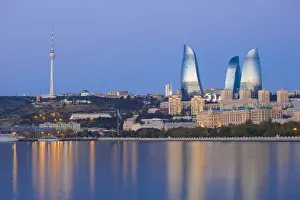 Azerbaijan, Baku, View of the Flame Towers reflecting in the Caspian Sea