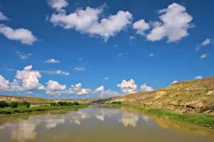 Empress Prints: Badlands and clouds reflected in the South Saskatchewan River off Hwy 41 Near Empress