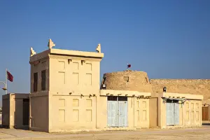 Bahrain, Manama, Arad Fort and traditional buildings with wind towers