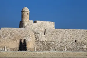 2 People Prints: Bahrain, Manama, Women walking past Bahrain Fort - Qal at al-Bahrain