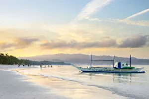 Bangka outrigger boat at sunrise on White Beach, Boracay Island, Aklan Province, Western