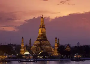 Bangkok, Thailand. The Wat Arun temple across the Chao Phraya River at sunset