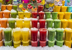 Market Stall Prints: Barcelona, Catalonia, Spain, Southern Europe. Fresh colored juices at the Boqueria Market