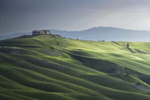 Farm Collection: A barn and the rolling hills, Crete Senesi, Tuscany, Italy