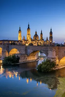 Basilica-Cathedral of Our Lady of the Pillar & Roman Bridge Over Ebro River at Dusk