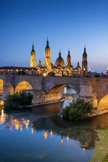 Zaragoza Prints: Basilica-Cathedral of Our Lady of the Pillar & Roman Bridge Over Ebro River at Dusk