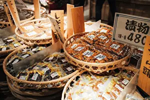 Retail Prints: Baskets of Japanese pickles (tsukemono) are displayed for sale at a market. Japan