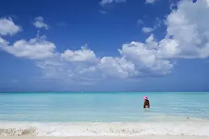 Girls Prints: A bather with a pink hat in the turquoise waters of the Caribbean Sea The Nest Antigua