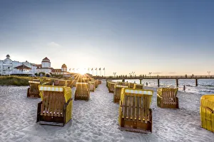 Images Dated 16th May 2017: Beach baskets and Kurhaus at sundown, Binz, RAogen Island, Mecklenburg-Western Pomerania