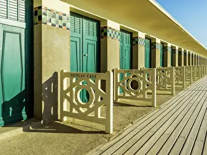 Beach Cabbins with Names of famous American Hollywood Movie Stars at Les Planges, the boardwalk on Deauville Beach DEAUVILLE, Cote Fleurie, Calvados Normany, France
