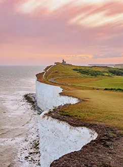 Beachy Head Cliffs and Belle Tout Lighthouse at sunset, Eastbourne, East Sussex, England, United Kingdom