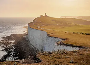 Beachy Head Cliffs and Belle Tout Lighthouse at sunset, Eastbourne, East Sussex, England, United Kingdom