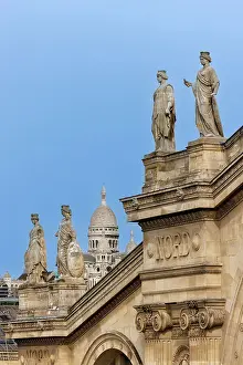 Sacre Coeur Prints: The beautiful fascade of the Gare du Nord station with the Sacre Coeur beyond